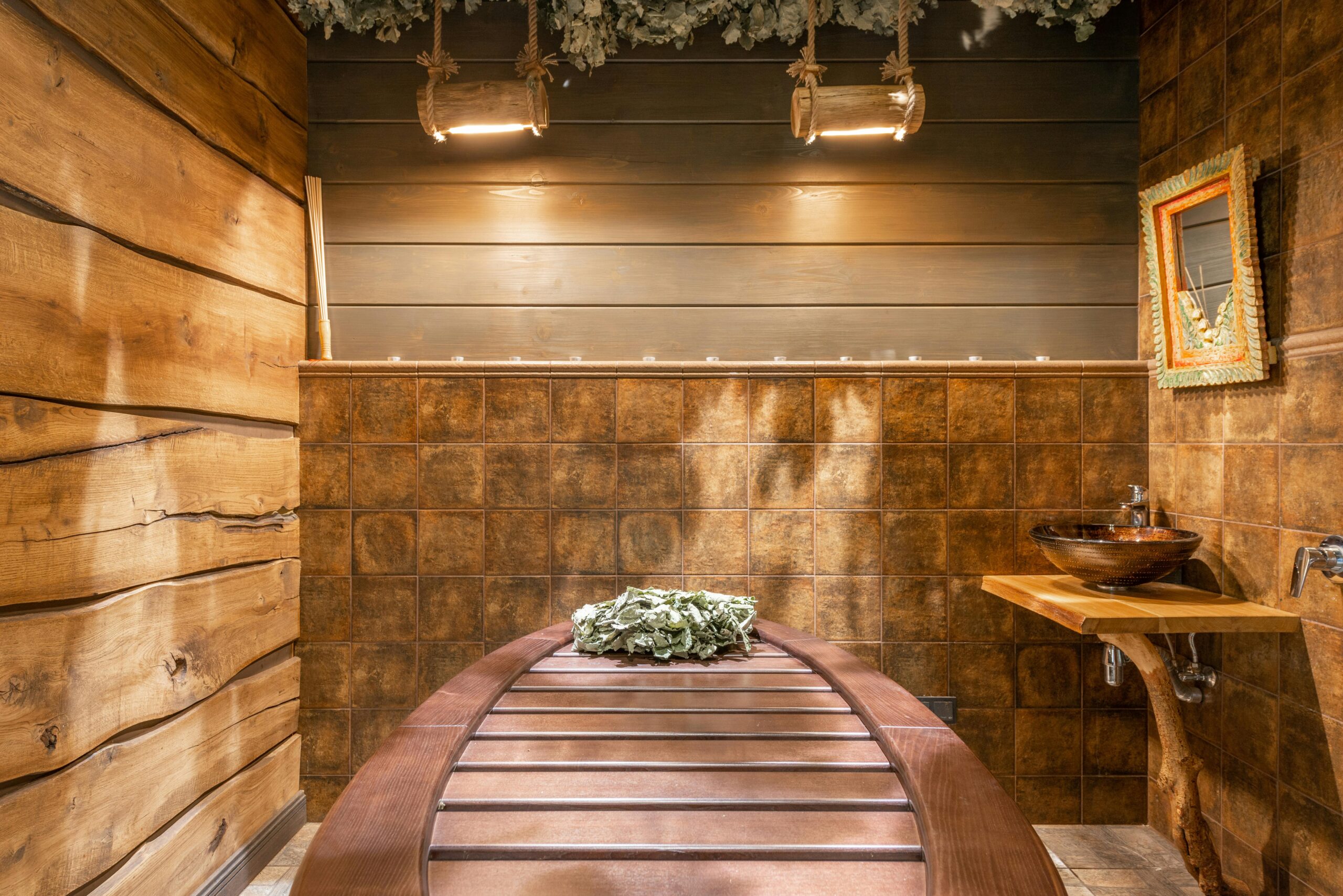 Cozy rustic sauna interior featuring wooden accents and natural decor for ultimate relaxation.